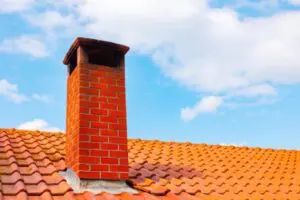 Brick chimney on a roof